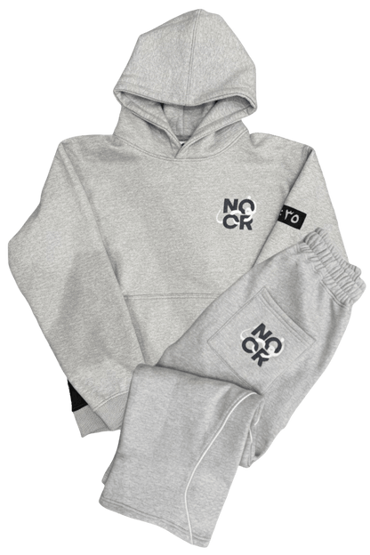 Gray Hoodie and Pants tracksuit featuring Arabic, premium stitching, and streetwear style from Noor Apparel.